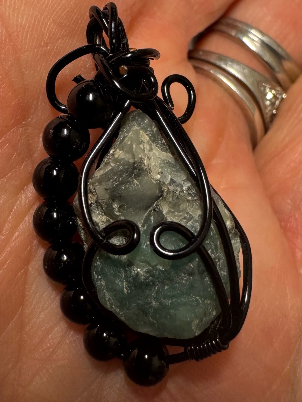 Rough Emerald (Unpolished) With Smooth Obsidian Beads In Black Wire Wrap